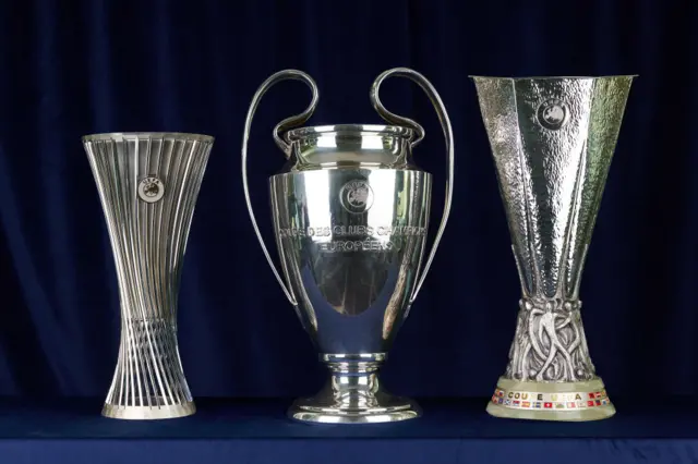 The Conference League, Champions League and Europa League trophies