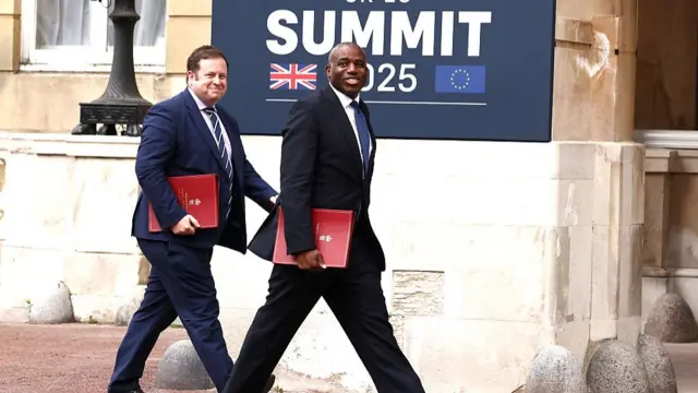 David Lammy and MP Stephen Doughty, caught mid-stride walking into the summit.
