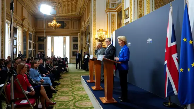 European Council President Antonio Costa and UK Prime Minister Keir Starmer look on as President of the European Commission, Ursula von der Leyen speaks during a press conference at the UK-EU summit at Lancaster House