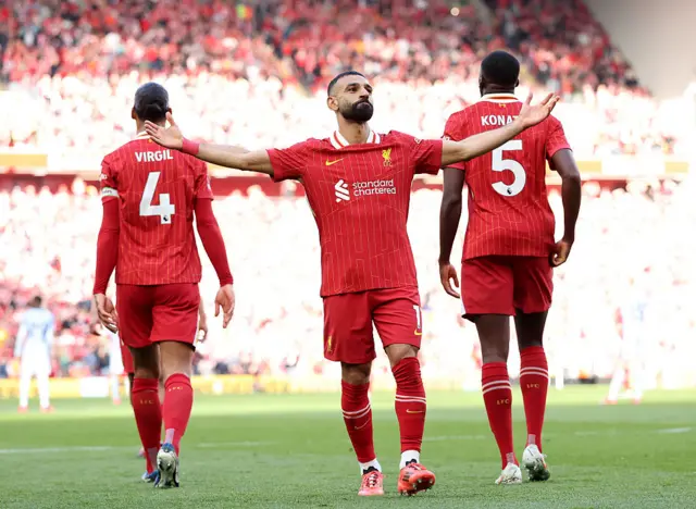 Mohamed Salah celebrating with his arms out