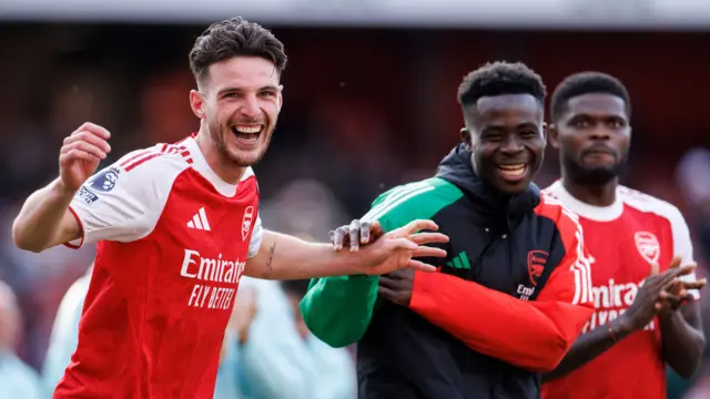 Declan Rice and Bukayo Saka smiling after Arsenal beat Newcastle