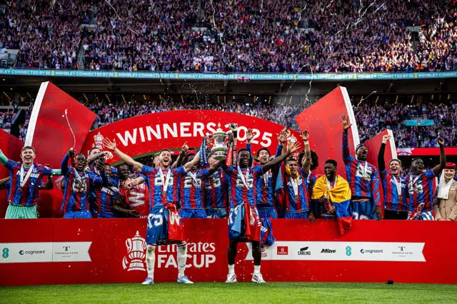 Crystal Palace squad celebrate with the FA Cup at Wembley
