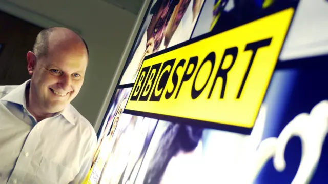 File image of Mosey standing next to old BBC Sport logo