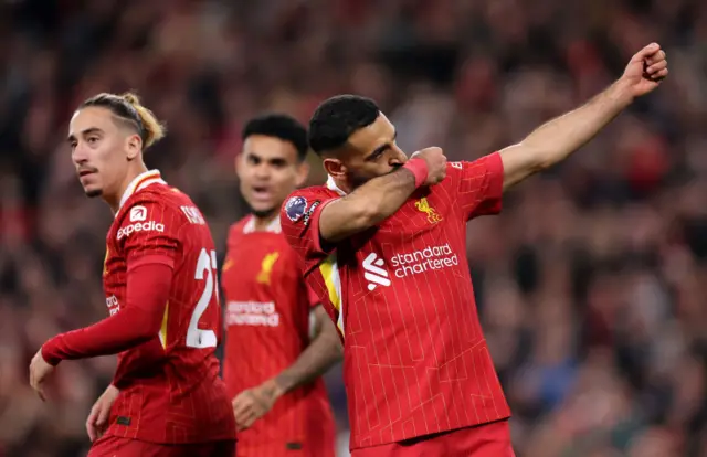 Mohamed Salah of Liverpool celebrates scoring his team's second goal during the Premier League match between Liverpool FC and Brighton & Hove Albion FC at Anfield on November 02, 2024 in Liverpool,
