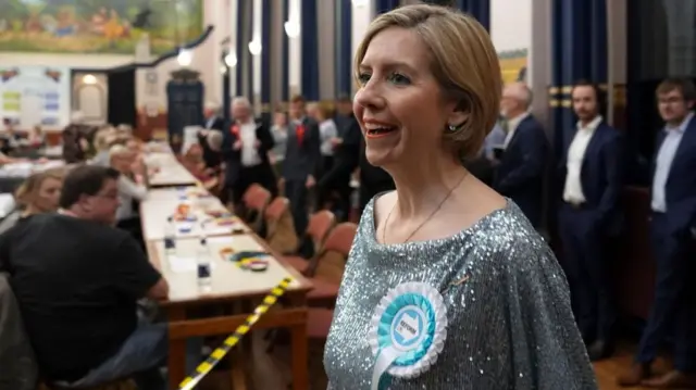Dame Andrea Jenkyns at the count wearing a sparkly blue dress