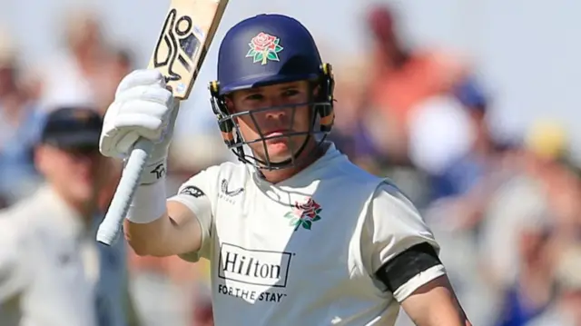 Marcus Harris celebrates scoring fifty