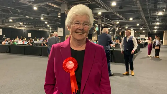 Labour's Ros Jones at the count, smiling and wearing a red rosette
