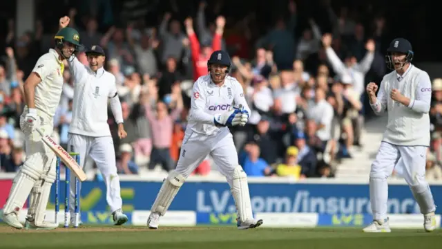 Wicket-keeper Jonny Bairstow appeals for a catch with Joe Root and Harry Brook in an Ashes Test against Australia