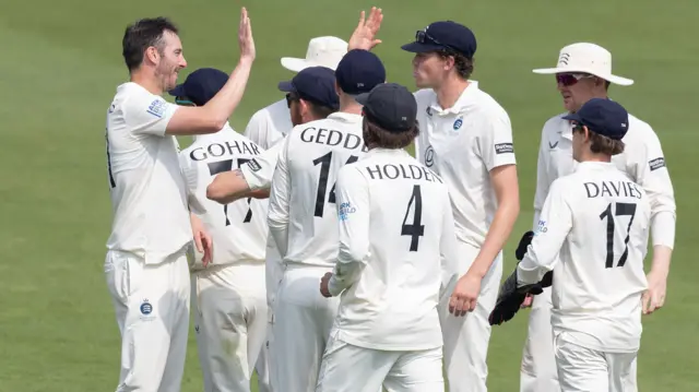Toby Roland-Jones celebrates wicket