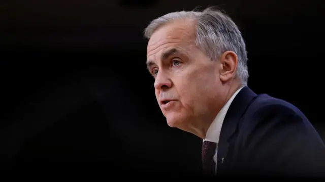 Carney headshot speaking