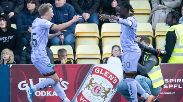 Partick's Ben Stanway and Kanayo Megwa celebrate after an own goal gives them a 1-0