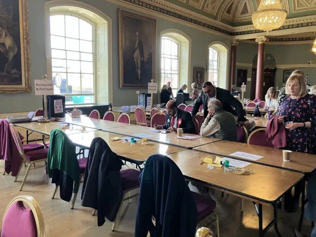 The wrapping-up of a vote verification in Worcester's Guildhall.