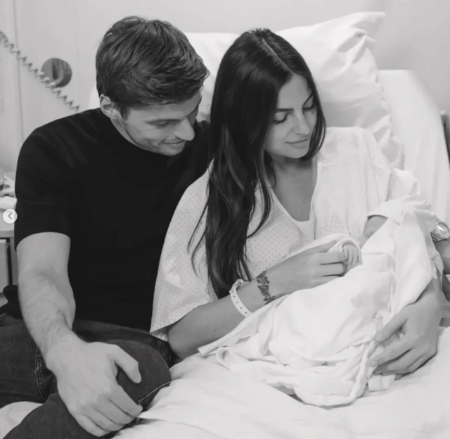 Max Verstappen and Kelly Piquet pose for a photograph with their new daughter Lily
