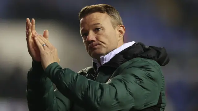 Reading boss Noel Hunt applauding supporters