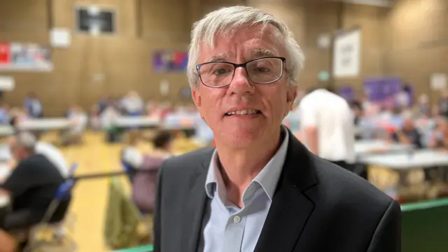 Steve Jarvis standing in an election count