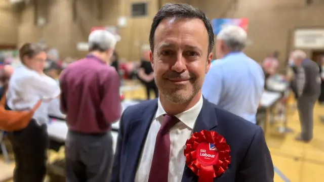 Kevin Bonavia standing in an election count