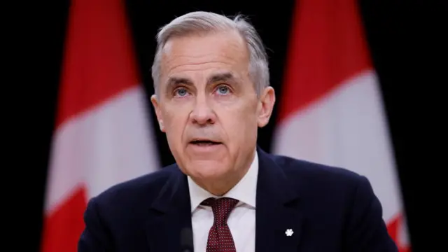 Carney headshot speaking
