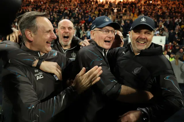 Falkirk Manager John McGlynn and his coaching staff celebrate promotion