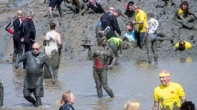 Competitors take part in the Maldon Mud Race