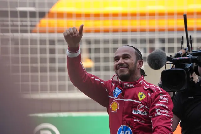 Lewis Hamilton gives a thumbs up to the crowds in China