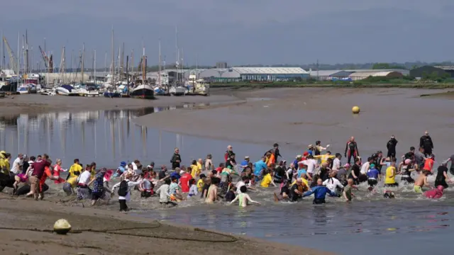 Competitors take part in the annual Maldon Mud Race