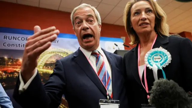 Nigel Farage, leader of the Reform party, reacts with his mouth hanging open