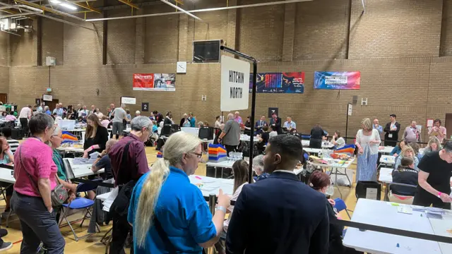 A large group of people at an election count