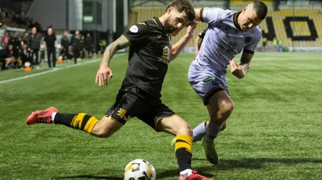 Partick's Aidan Fitzpatrick and Livingston's Jamie Brandon in action