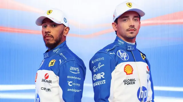 Lewis Hamilton and Charles Leclerc wear blue and white race suits
