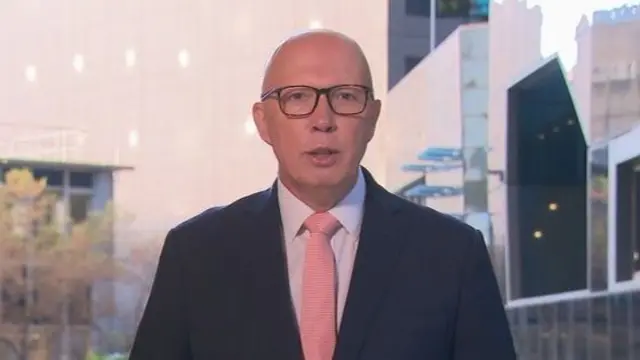 Opposition leader Peter Dutton wears a suit with red tie as he appears on Channel 9.
