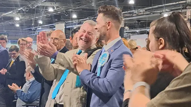 Reform supporters clapping