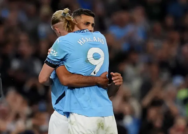 Manchester City's Rodri with Erling Haaland as he comes off the bench to make his first appearance in eight months following injury,