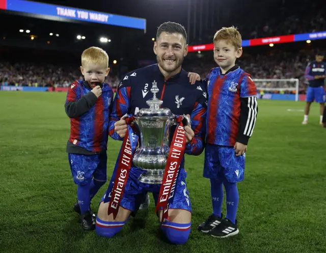 Crystal Palace's Joel Ward poses for a photograph with his children and the trophy of the FA Cup