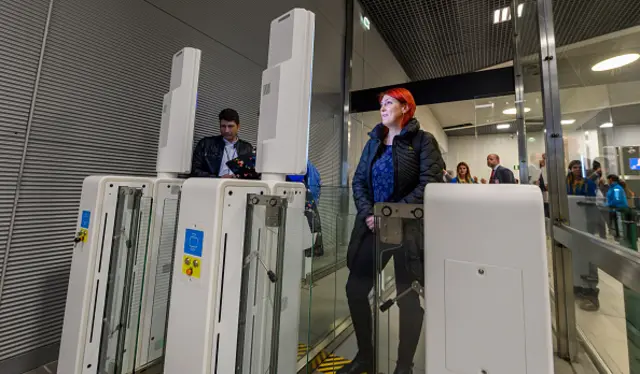 Arriving passengers go through e-gates for Automated Border Control at a new area