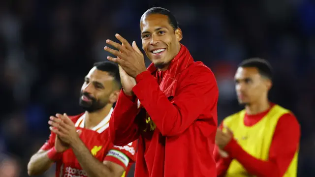 Virgil van Dijk applauds the Liverpool fans after the team's defeat Brighton