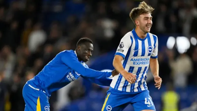 Yankuba Minteh and Jack Hinshelwood celebrate after Brighton's win over Liverpool