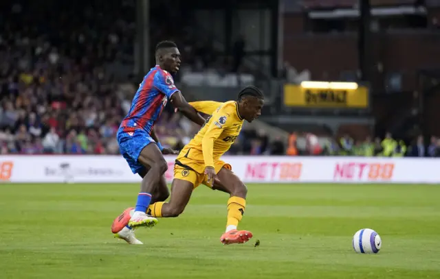 Crystal Palace's Ismaila Sarr (left) and Wolverhampton Wanderers' Jean-Ricner Bellegarde (right) battle for the ball
