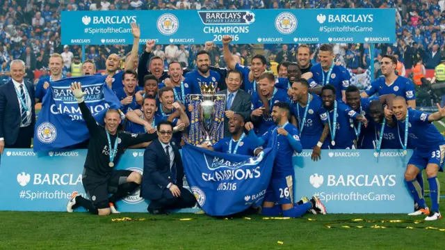 Leicester City players and staff with the Premier League trophy in 2016