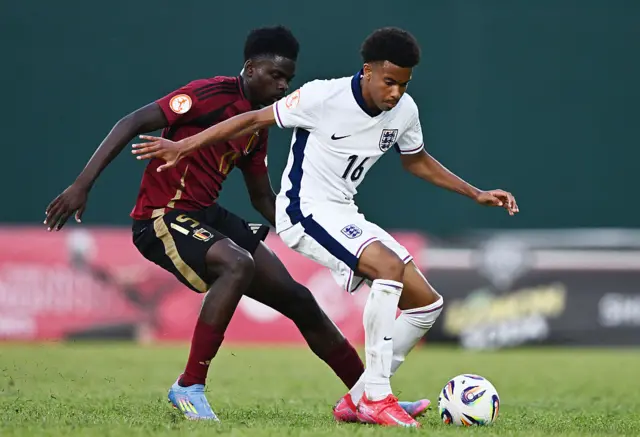 Louis Page of England is challenged by Matthias Wamu Oyatambwe of Belgium