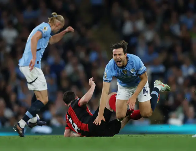 AFC Bournemouth's Lewis Cook fouls Manchester City's Nicolas Gonzalez