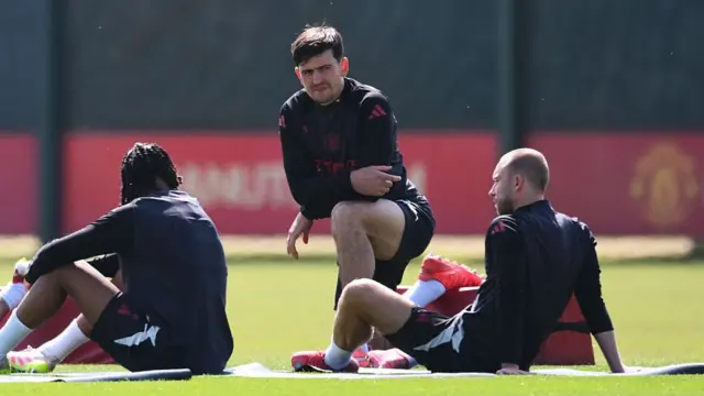 Harry Maguire does a stretching exercise
