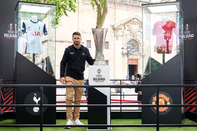 Uefa ambassador Aritz Aduriz has placed the trophy alongside replica Tottenham and Manchester United strips during the first day of the fan festival