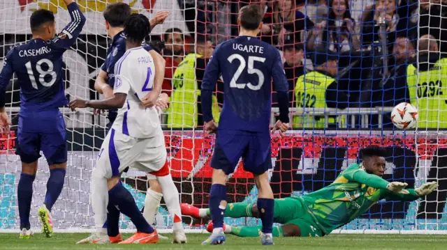 Manchester United goalkeeper Andre Onana concedes a goal by Lyon's Thiago Almada