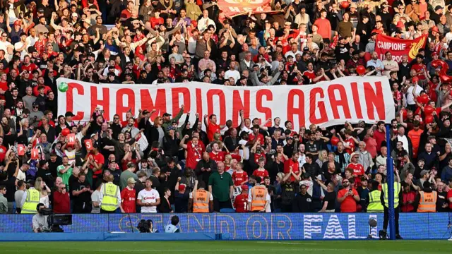 Liverpool fans hold up 'Champions Again' banner