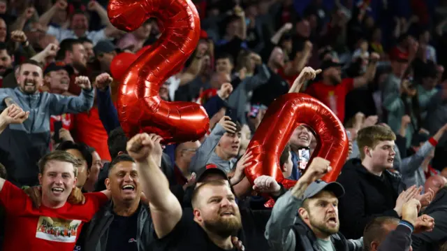 Liverpool fans celebrate after their game at Brighton