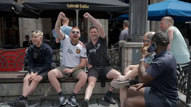 Fans of Manchester United enjoy the pre-match atmosphere