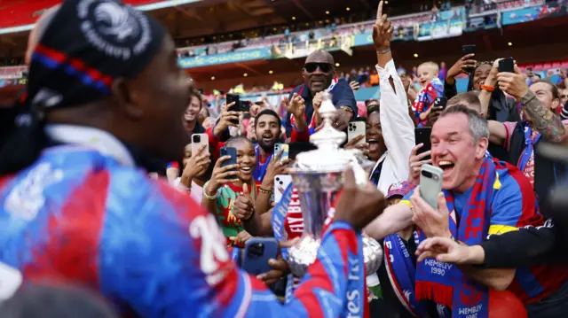 Crystal Palace players celebrate their 2025 FA Cup win with fans at Wembley