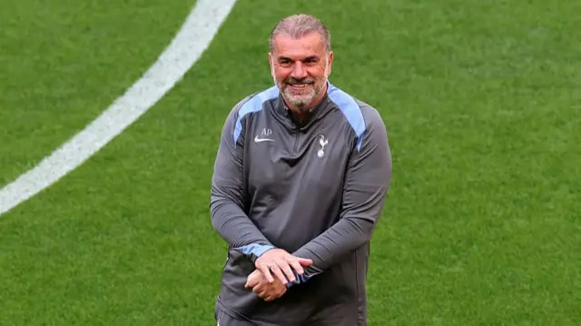 Ange Postecoglou smiles during training session
