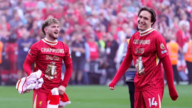 Harvey Elliott and Federico Chiesa smiling as they celebrate Liverpool clinching the Premier League title in 2025