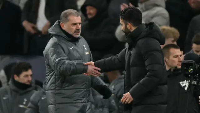 Tottenham Hotspur head coach Ange Postecoglou shakes hands with Manchester United head coach Ruben Amorim